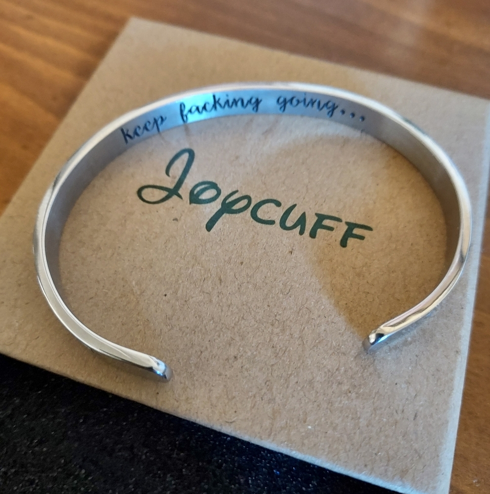 NWTs Joycuff Silver Cuff Bracelet With "Keep Fucking Going..." Engraved Inside